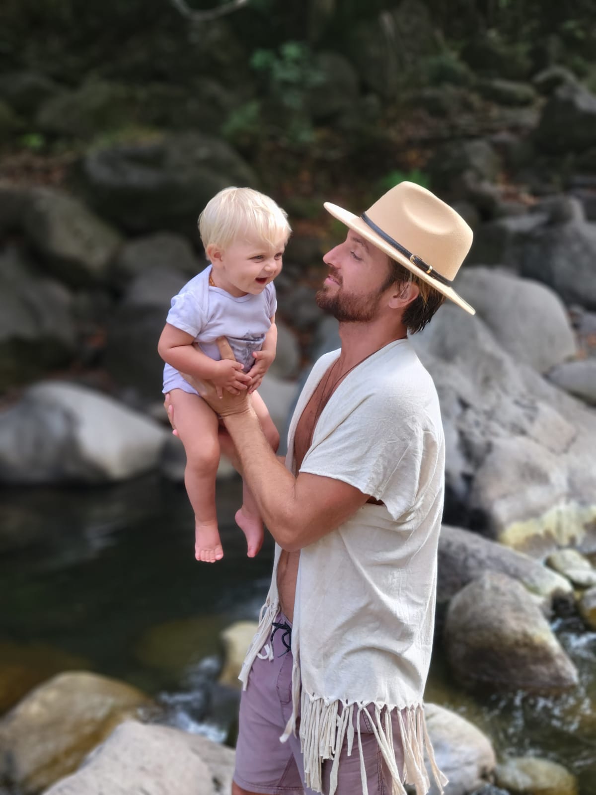 father and daughter in nature wearing eco printed baby onesie and hand dyed kimono