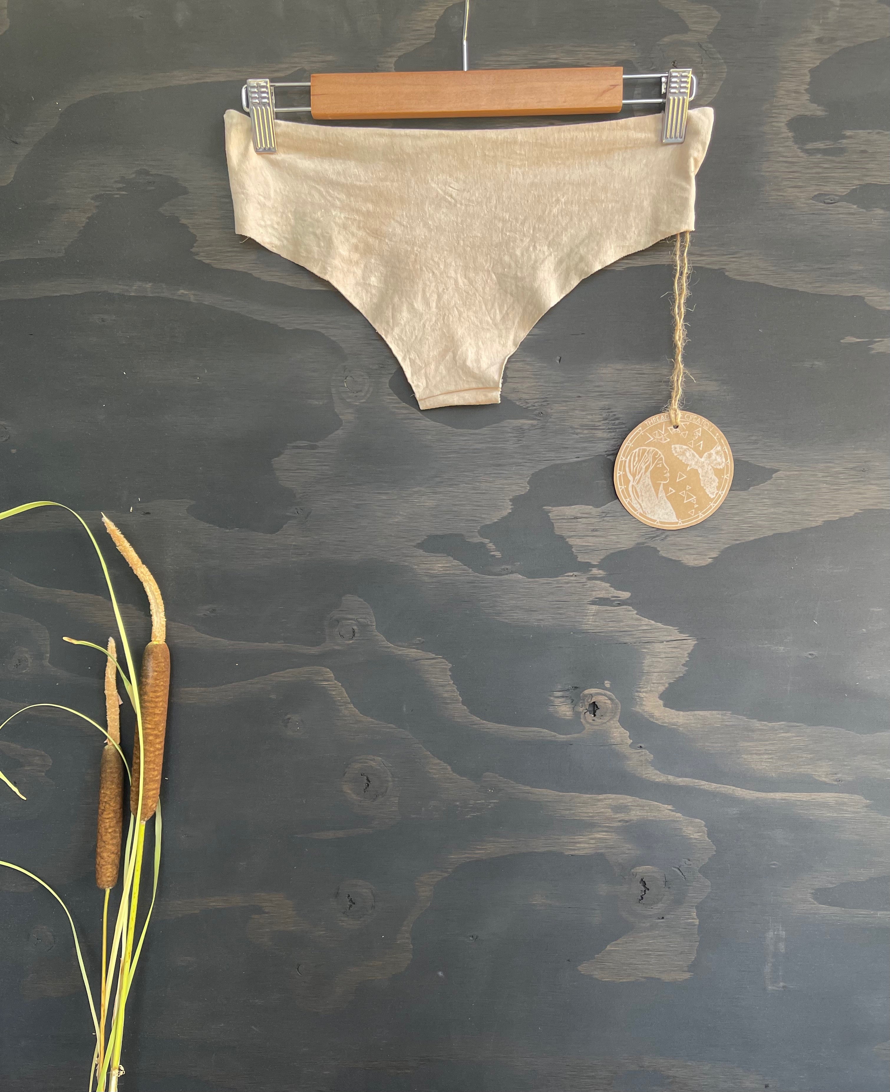 hemp panties in sage color on a wooden hanger