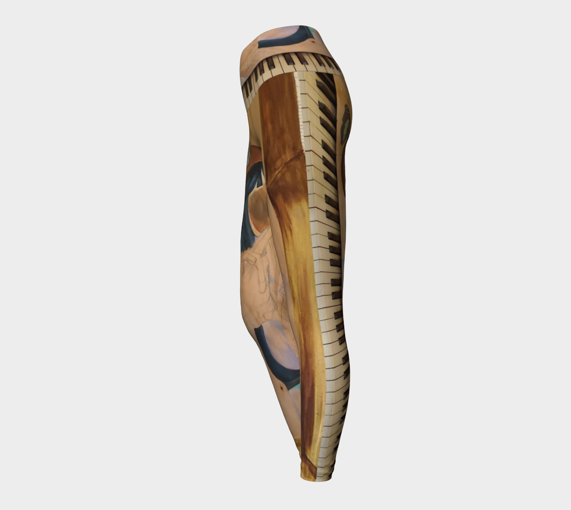 Yoga leggings with a wood grain and a teal butterfly with piano keys on them