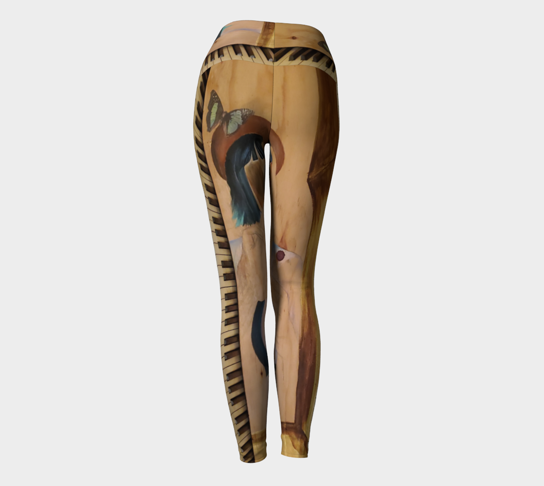 Yoga leggings with a wood grain and a teal butterfly with piano keys on them