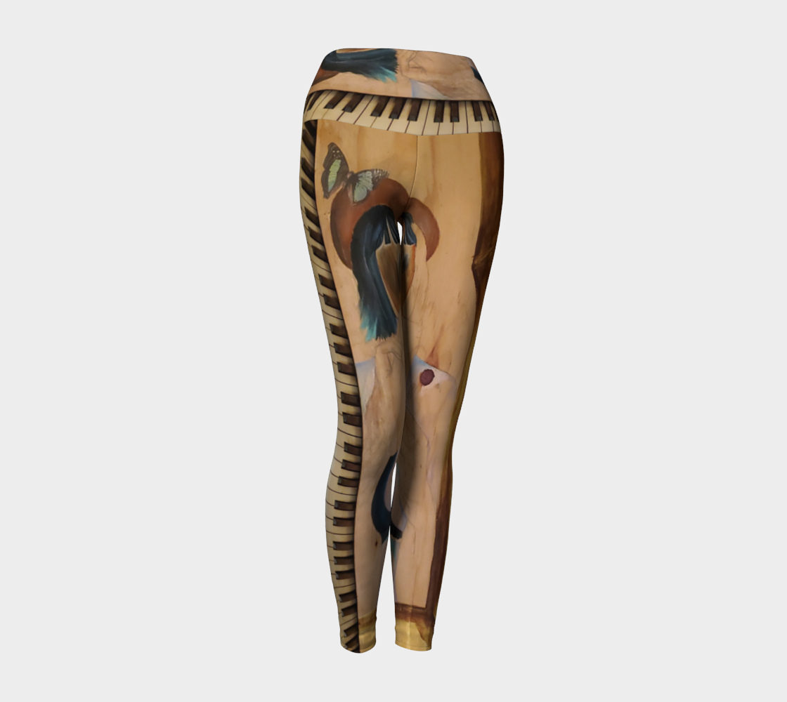 Yoga leggings with a wood grain and a teal butterfly with piano keys on them
