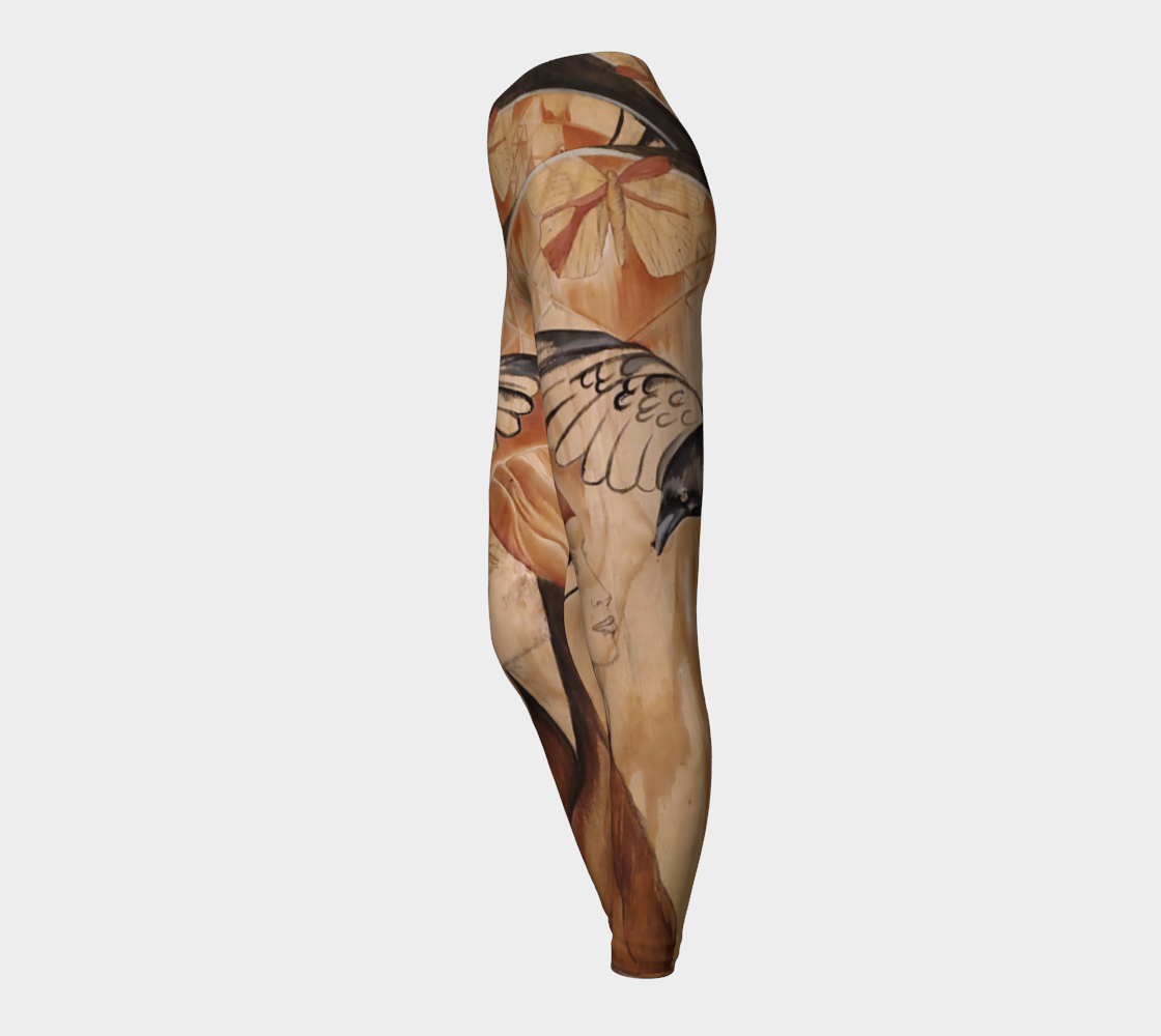 Yoga leggings with a painting of a woman and a raven on reclaimed wood in shades of brown and black and rust with a butterfly on the waistband