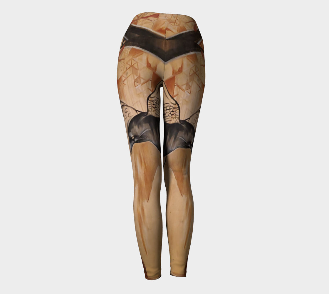 Yoga leggings with a painting of a woman and a raven on reclaimed wood in shades of brown and black and rust with a butterfly on the waistband