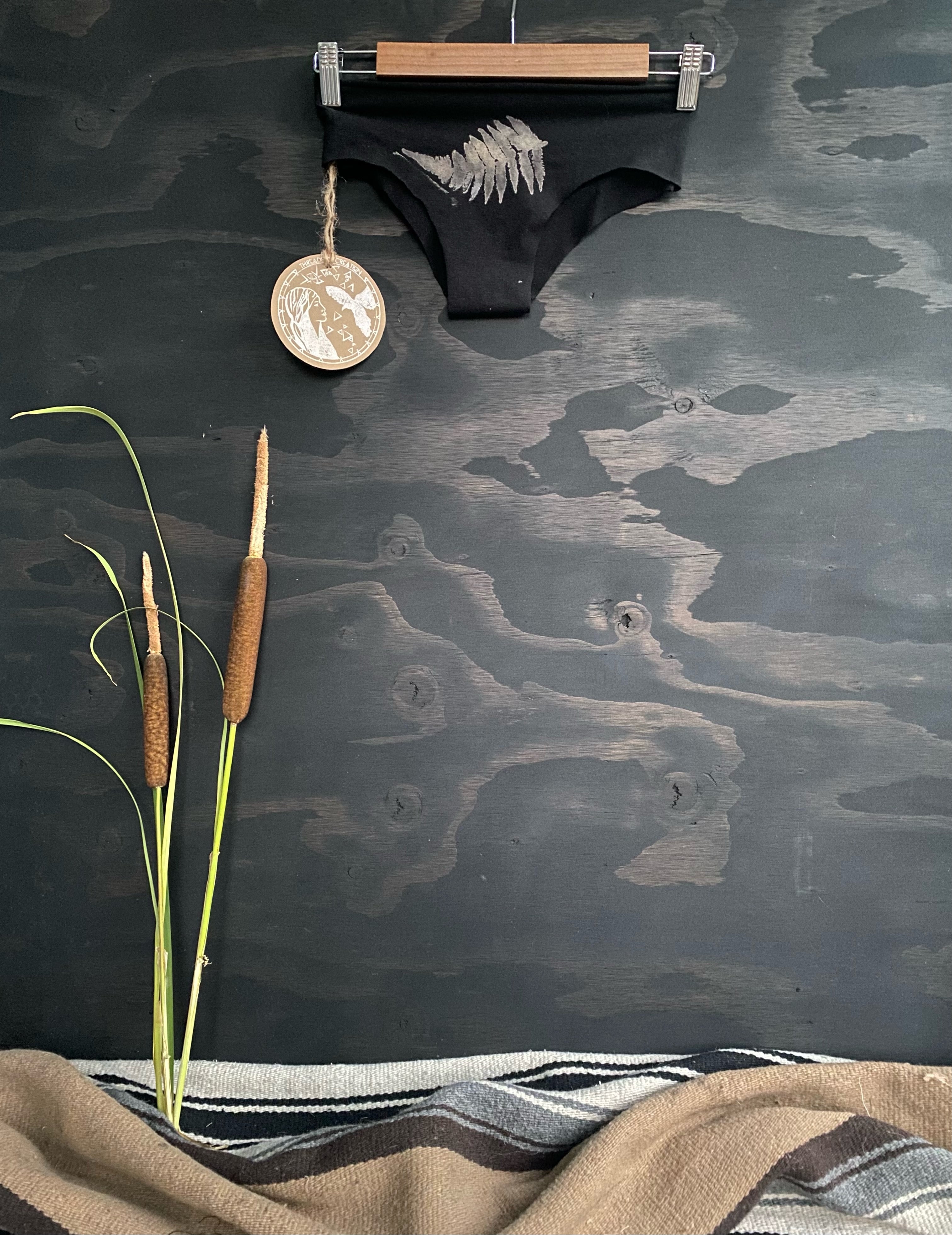 black panties with white fern imprint