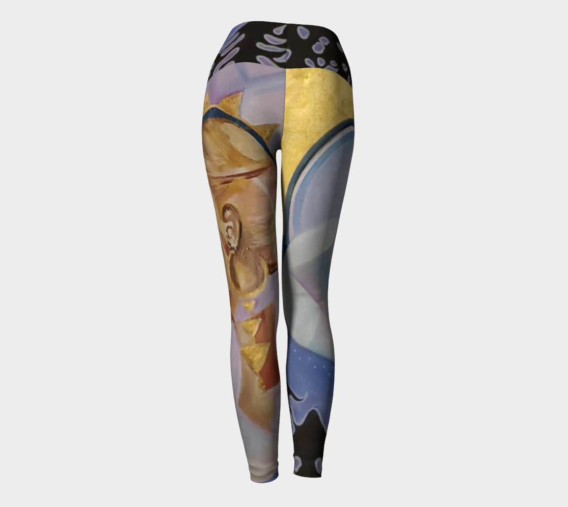 Yoga leggings with blue and purple hues and a face in tan and gold with black silhouetted trees and a moon