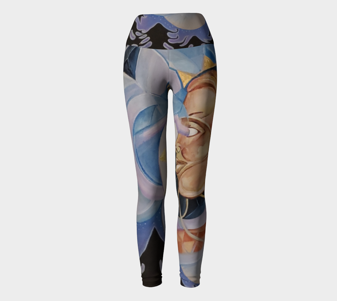 Yoga leggings with blue and purple hues and a face in tan and gold with black silhouetted trees and a moon