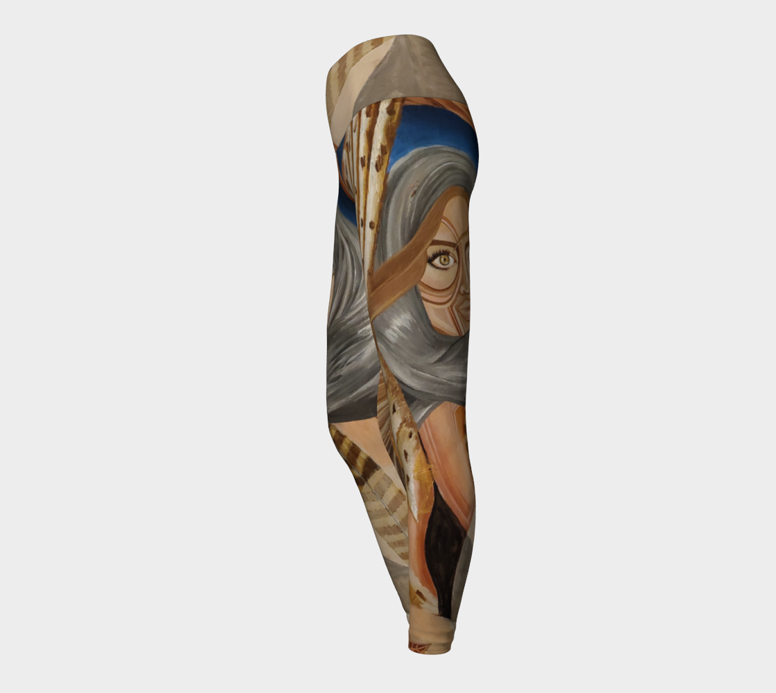 Yoga leggings in shades of blue and brown with a womans face and owl feathers painted in shades of white and tan and pink