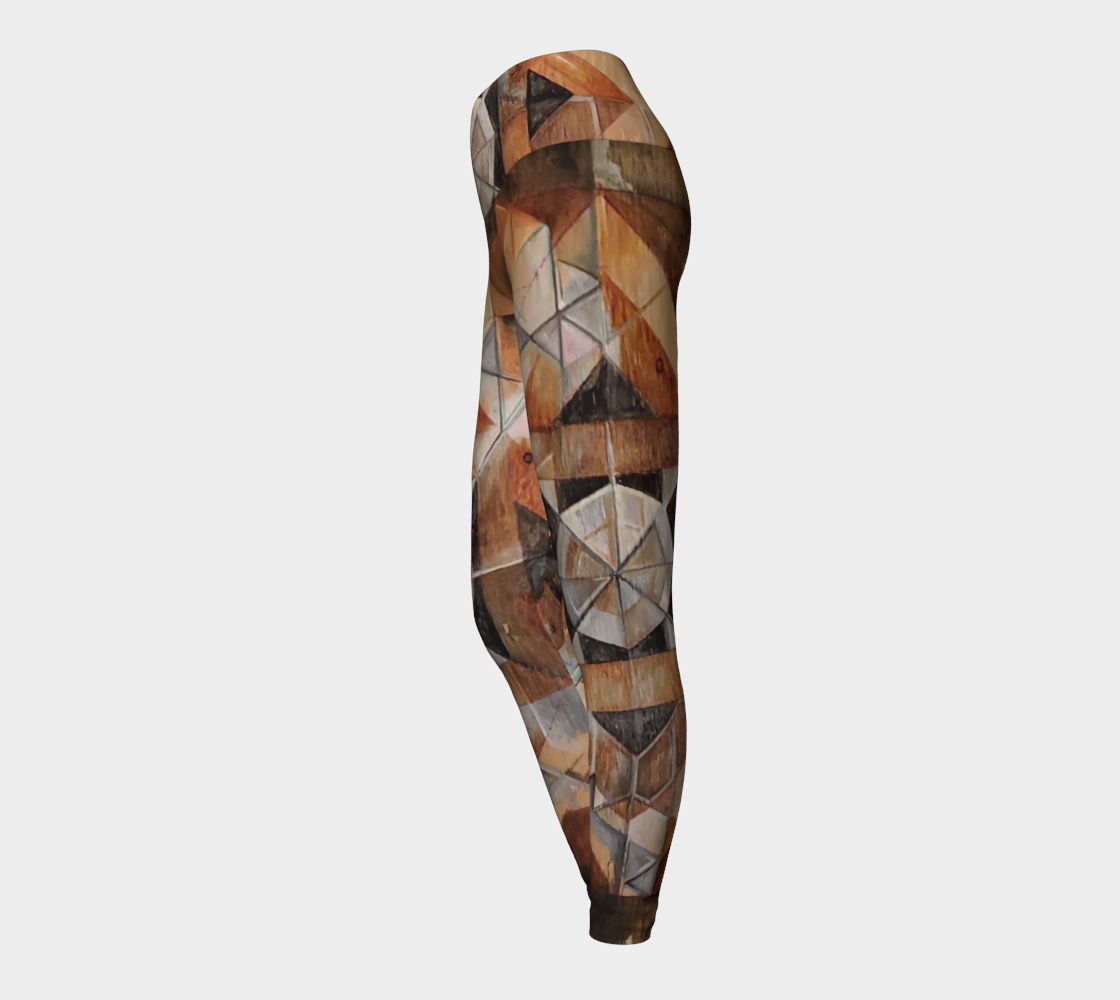 Yoga leggings with geometric pattern on wood grain with lines in black brown and rust and green
