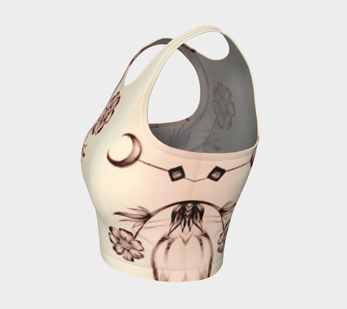 A white tank top with a floral pattern and crescent moons in pink and brown colors.