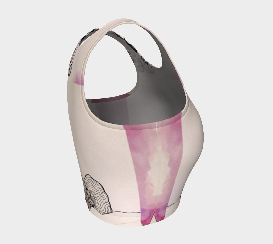 A beige yoga top with a floral and fungal design, featuring leaf patterns and what appears to be a stylized mushroom.