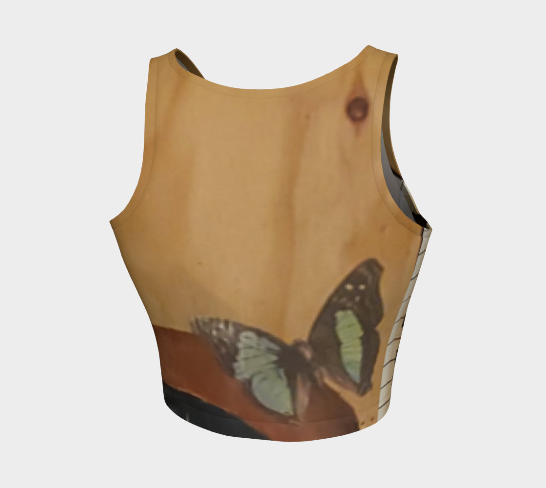 Yoga top with butterfly and piano painted onto wood in shades of brown and blue