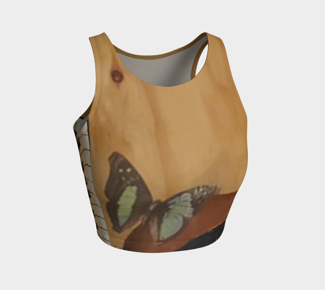 Yoga top with butterfly and piano painted onto wood in shades of brown and blue