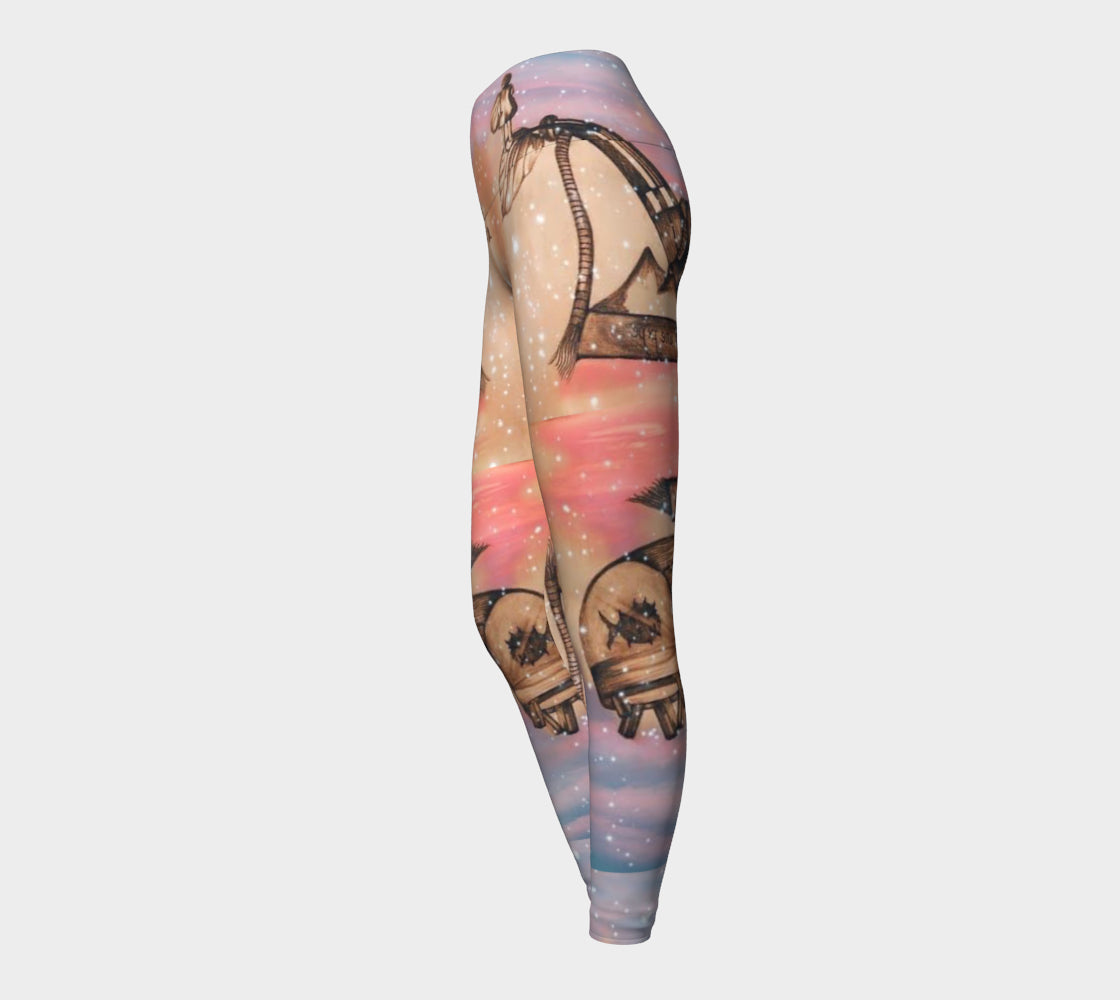 Yoga leggings in shades of pink and blue with a surreal pencil drawing of a little girl printed onto them