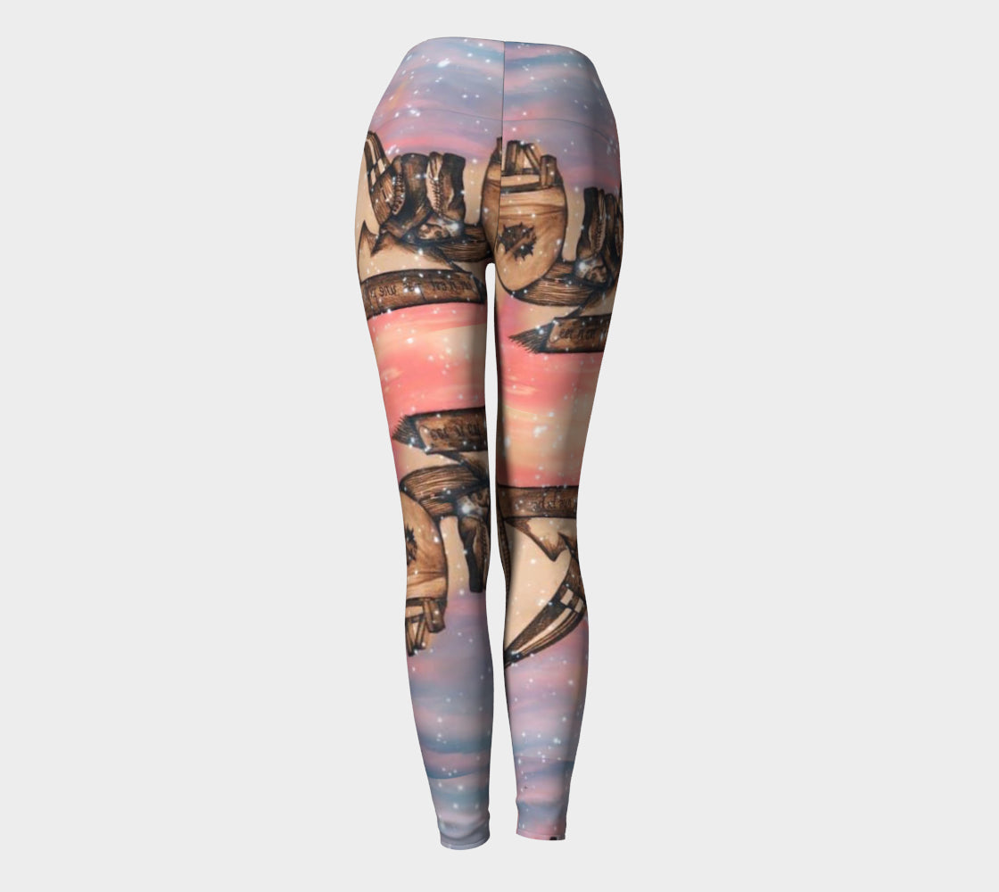 Yoga leggings in shades of pink and blue with a surreal pencil drawing of a little girl printed onto them