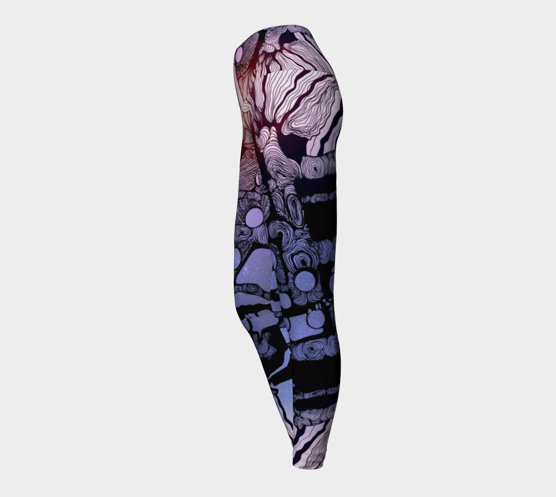 Yoga leggings in blue and purple with black line in the shape of a tree a woman and moons on them