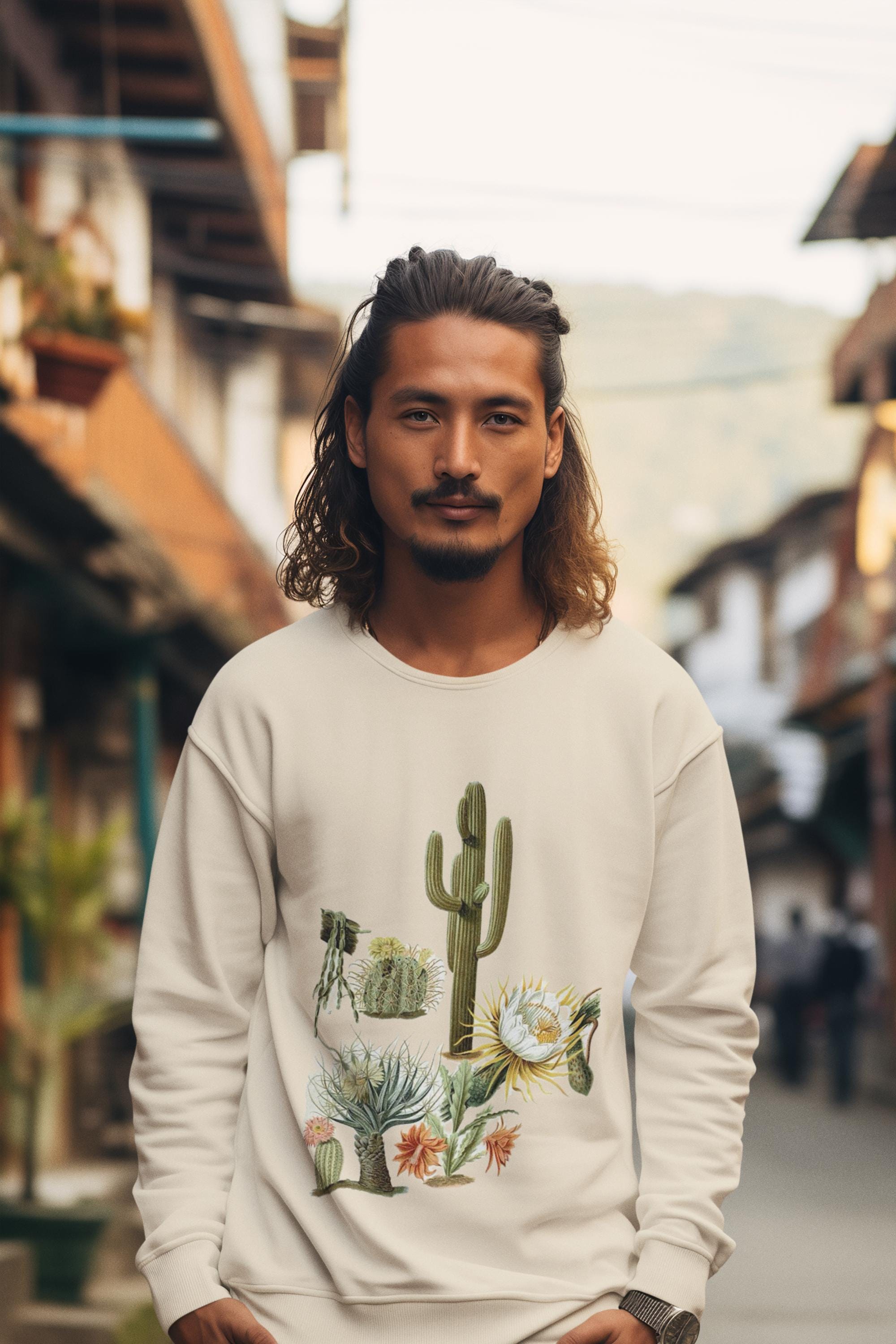 man wearing cream colored crew neck sweatshirt with cacti and blooms on it