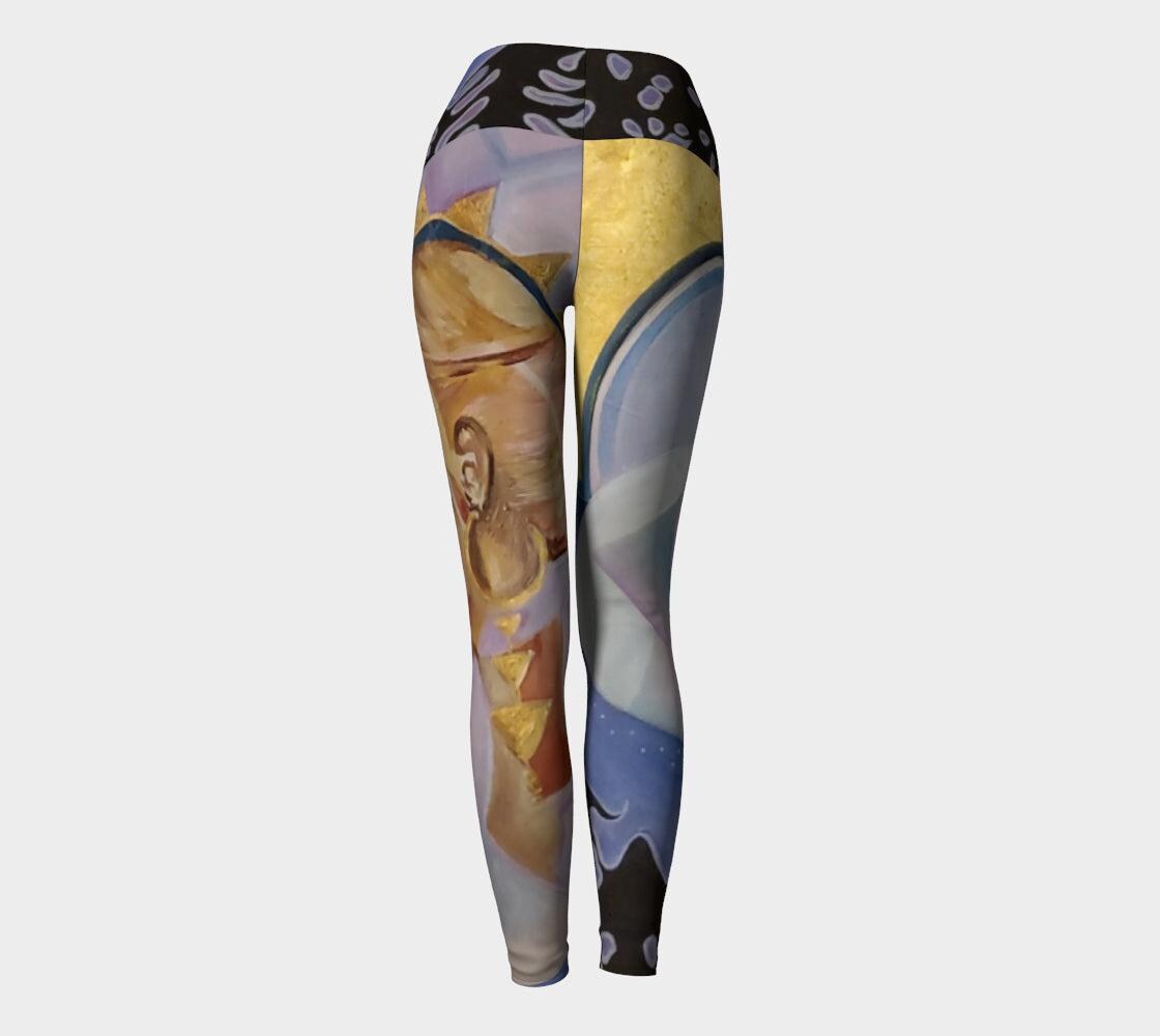Yoga leggings in purple and blue hues with profile of a woman face in gold and tan and geometric designs
