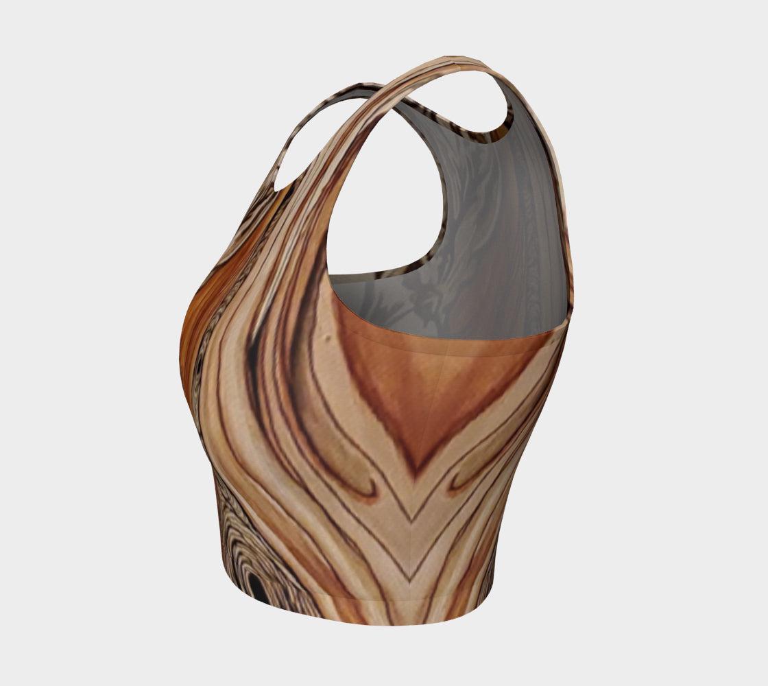yoga top with a floral and tree ring pattern in beige, brown, and black colors.