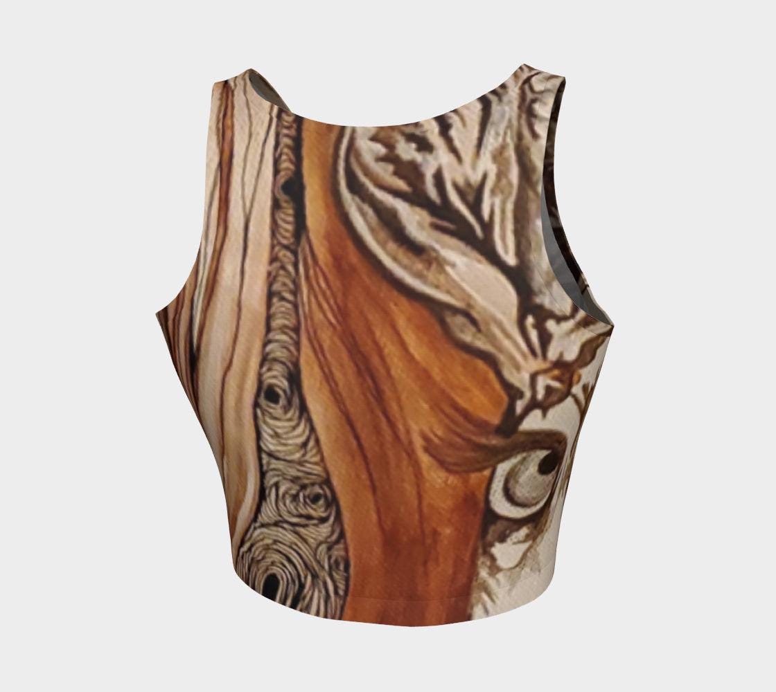 yoga top with a floral and tree ring pattern in beige, brown, and black colors.