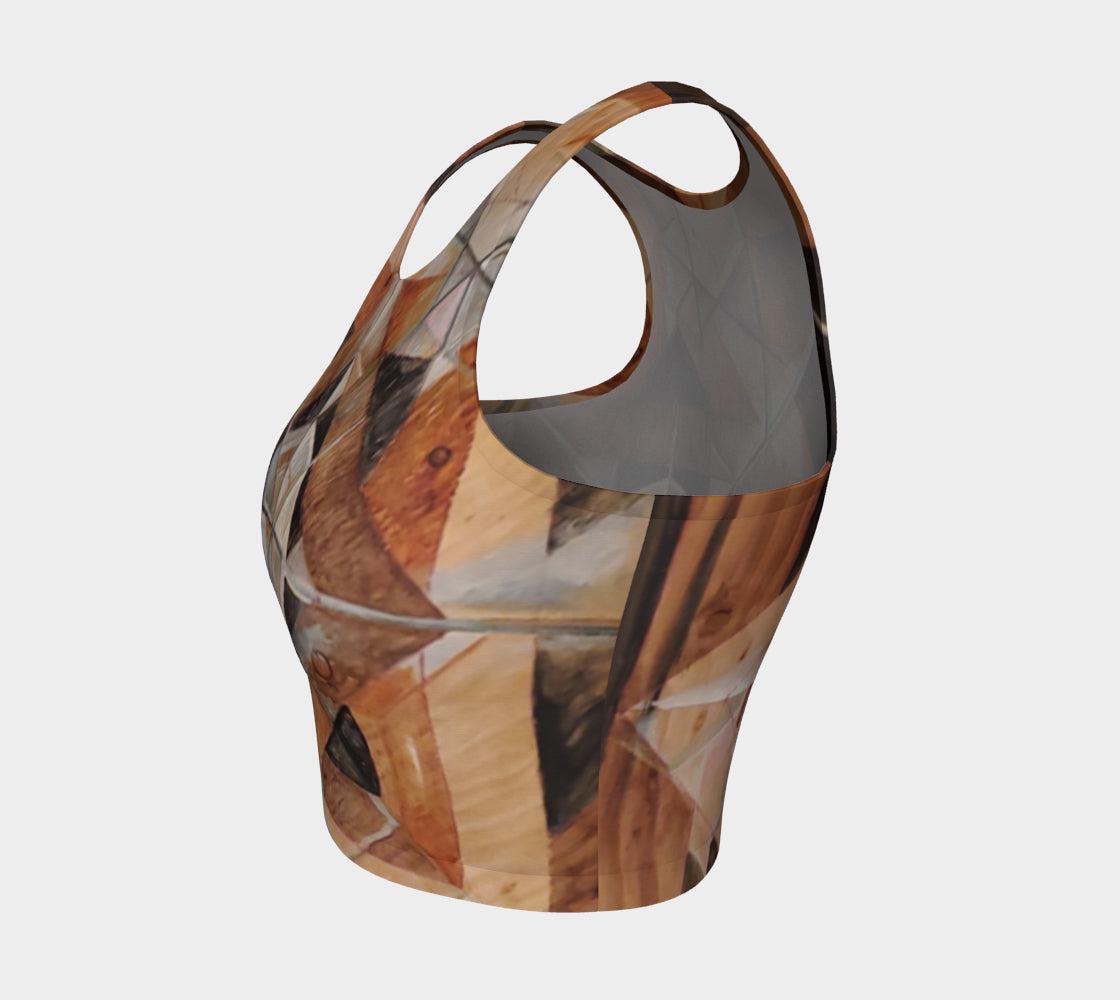 Yoga top with geometric designs in lines and shapes in shades of brown and black and rust and green