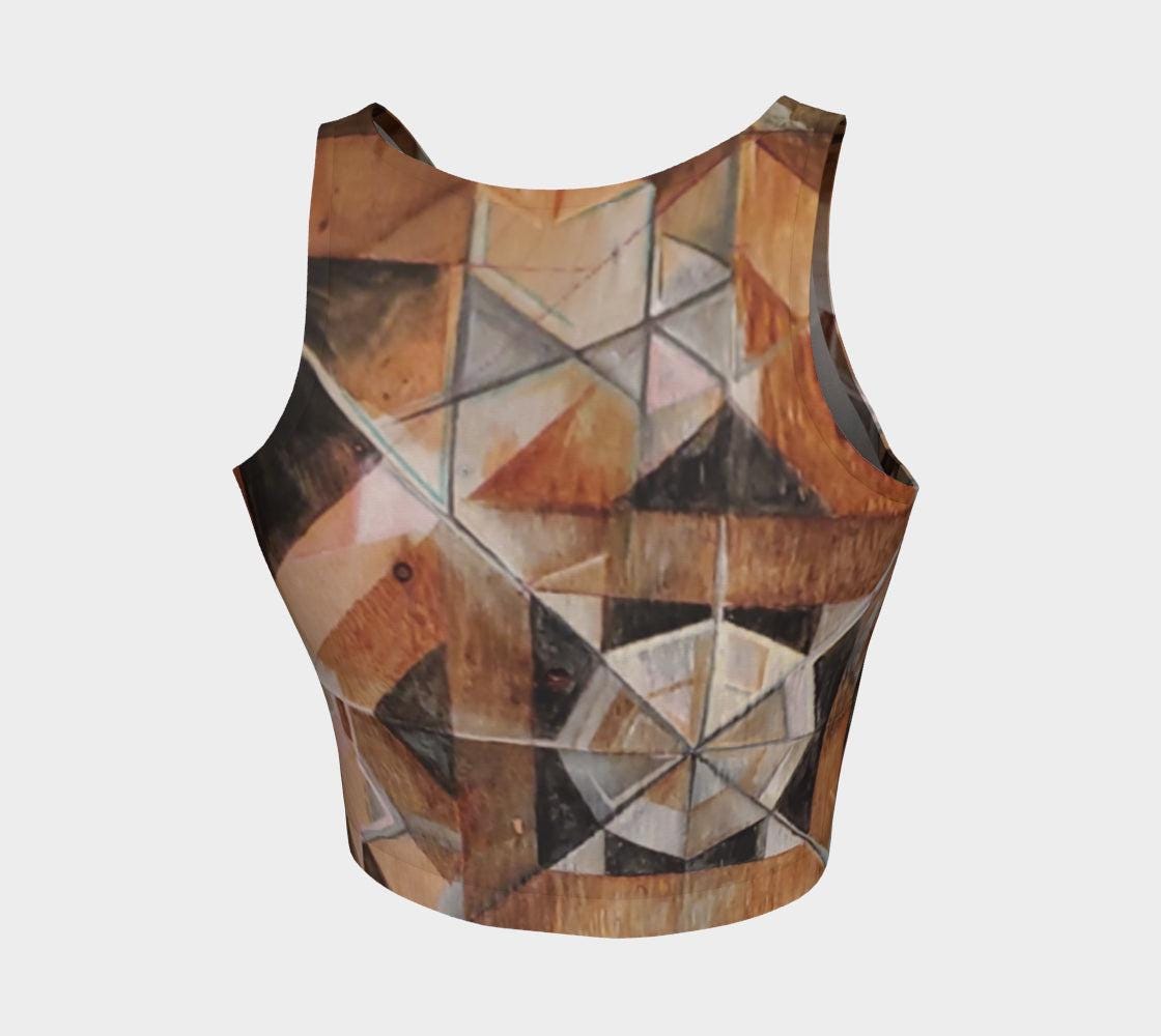 Yoga top with geometric designs in lines and shapes in shades of brown and black and rust and green