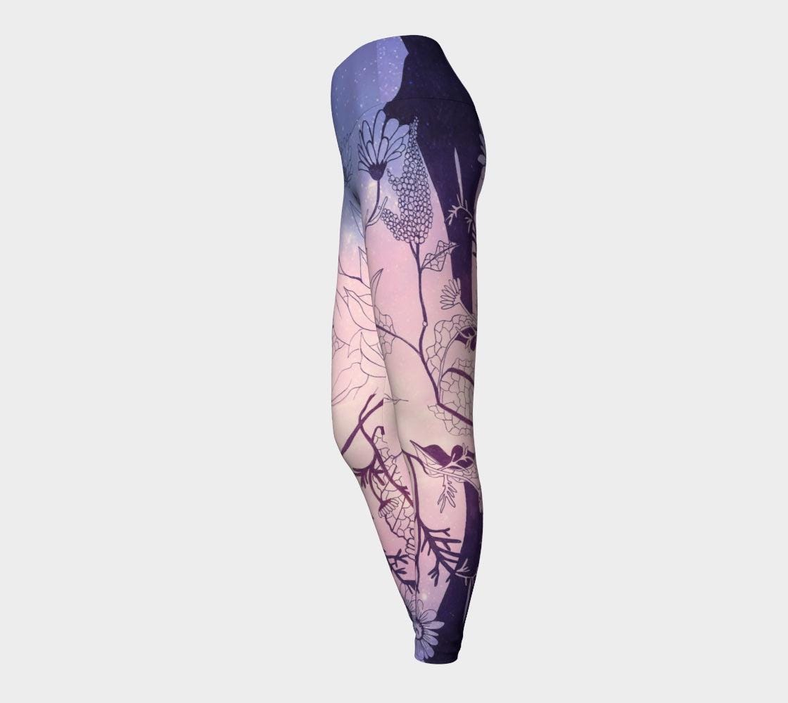 Yoga leggings in shades of pink and lilac with plants designs inline black lines on them