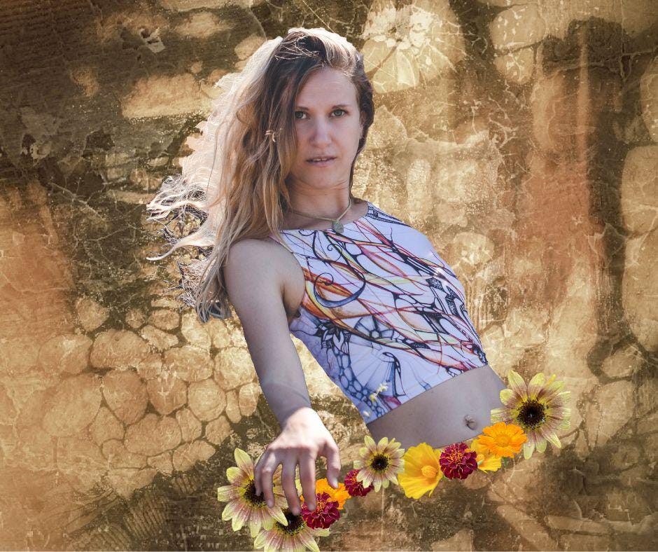 woman wearing Yoga top  in black and white with lines and abstract shapes with shades of red and orange