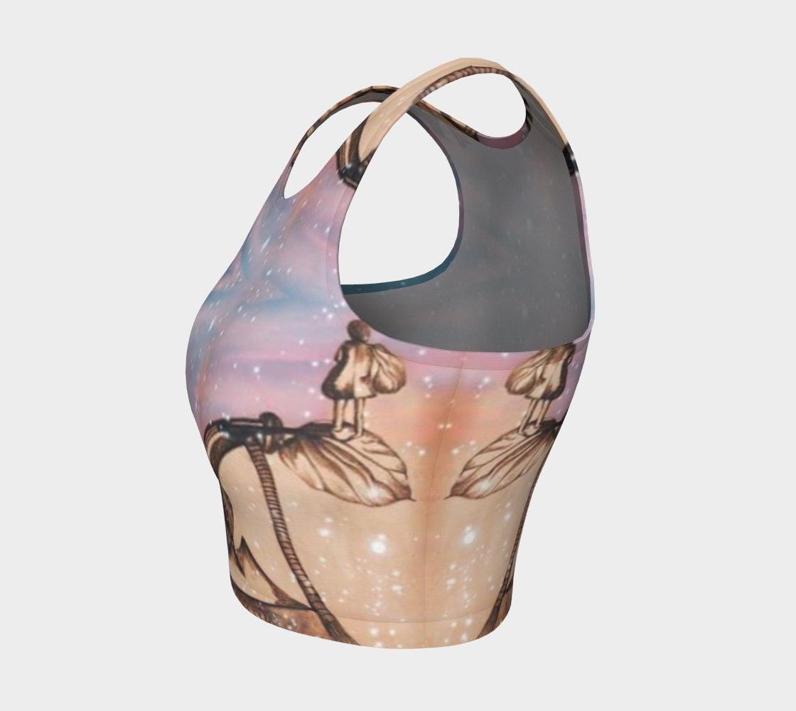 Yoga top in shades of pink and blue with a pencil drawing a little girl and stars flecked on it