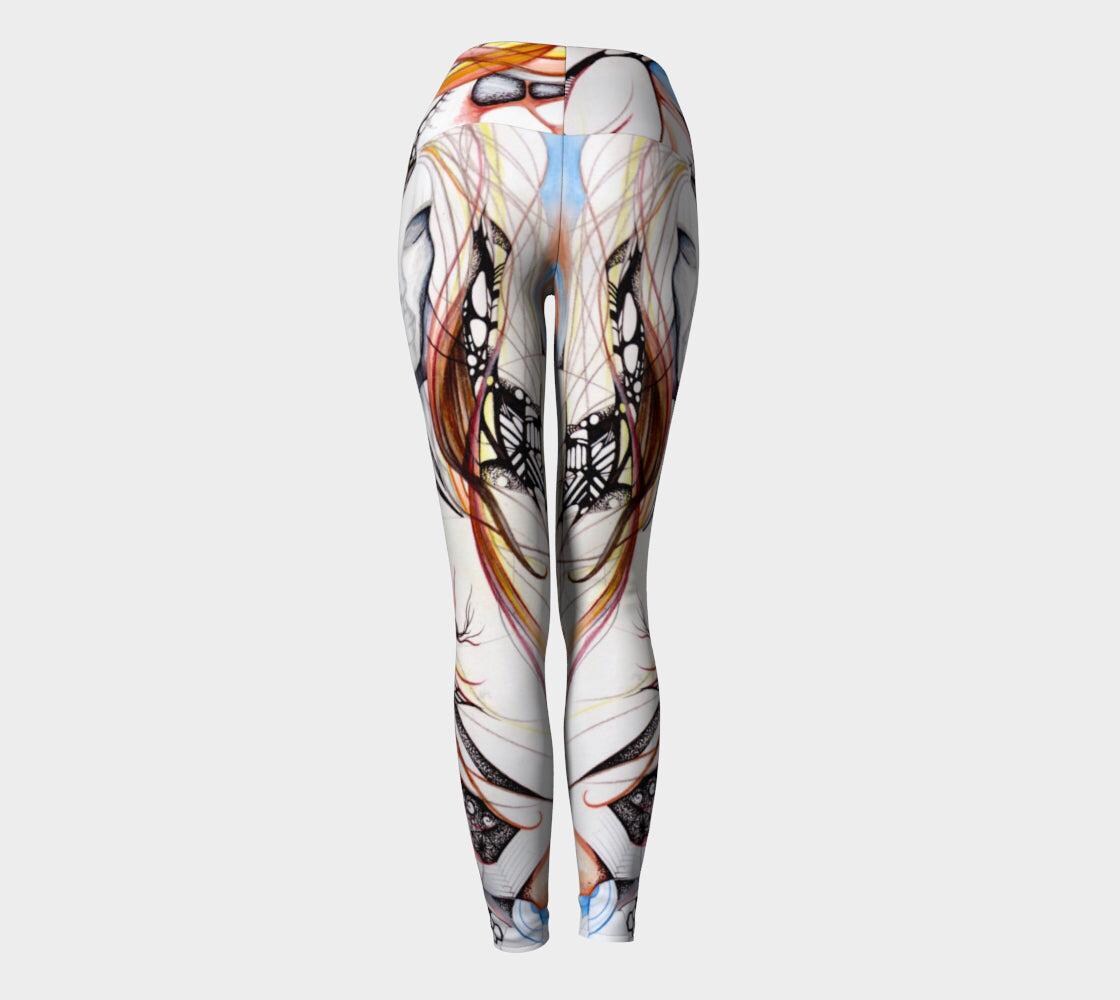 back view of winds of change yoga leggings an abstract design of lines and shapes in shades of black and white and blue and red