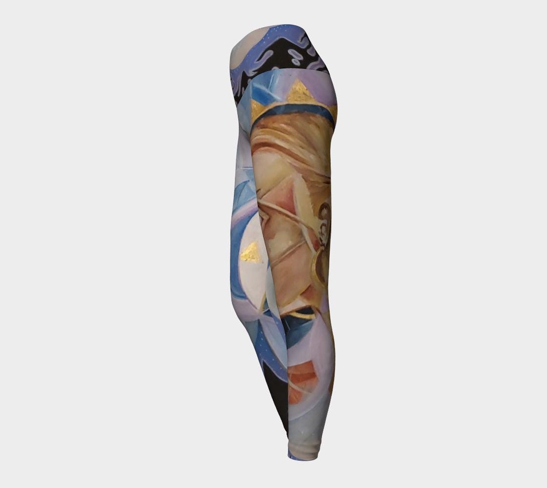 Yoga leggings in purple and blue hues with profile of a woman face in gold and tan and geometric designs