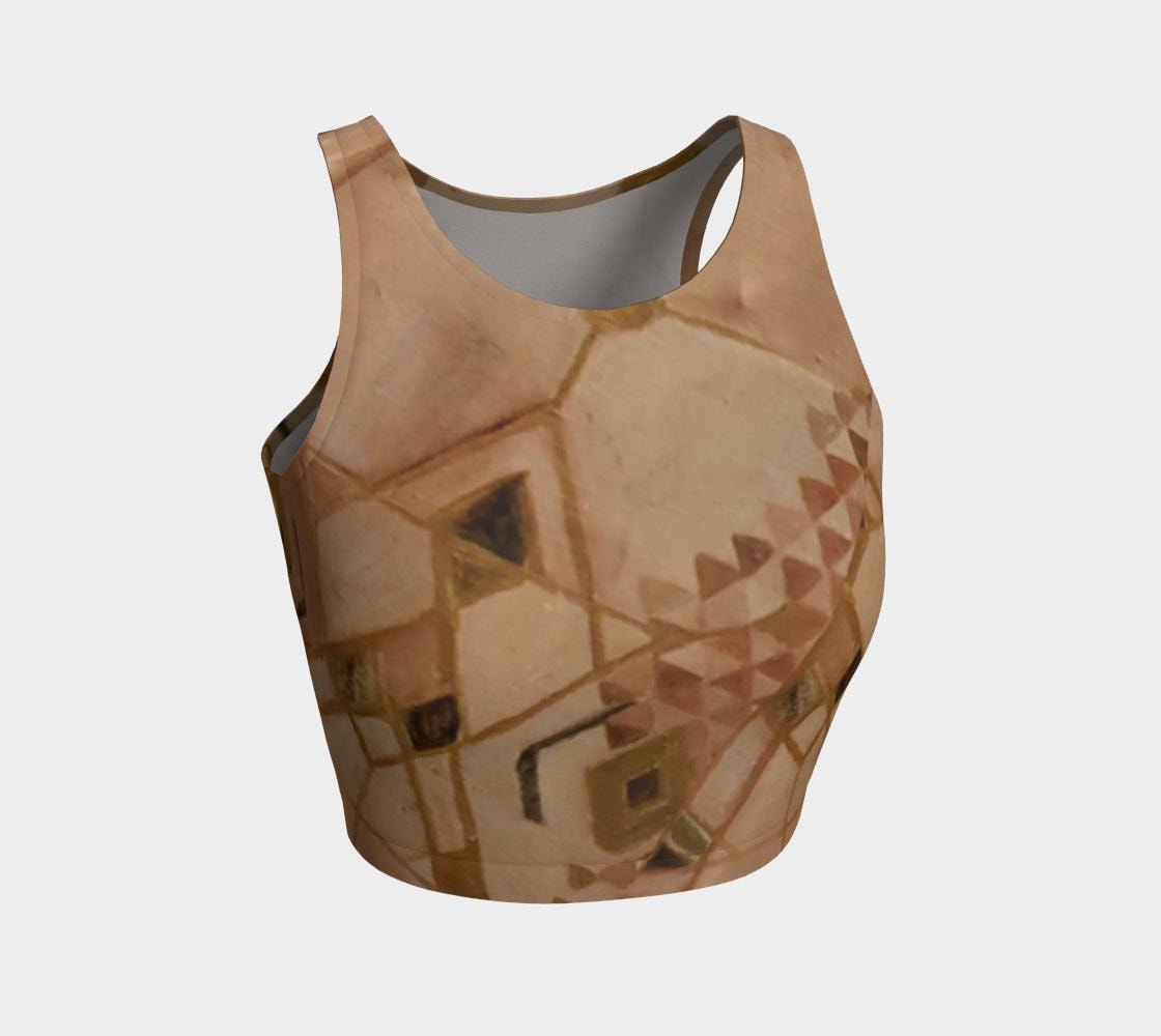 A beige cropped top with a geometric triangle pattern in various shades of brown, green, and tan.