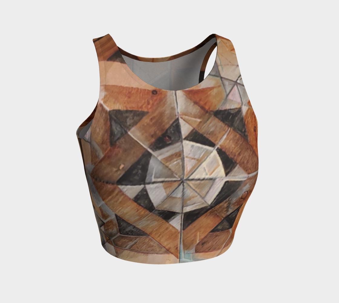 Yoga top with geometric designs in lines and shapes in shades of brown and black and rust and green