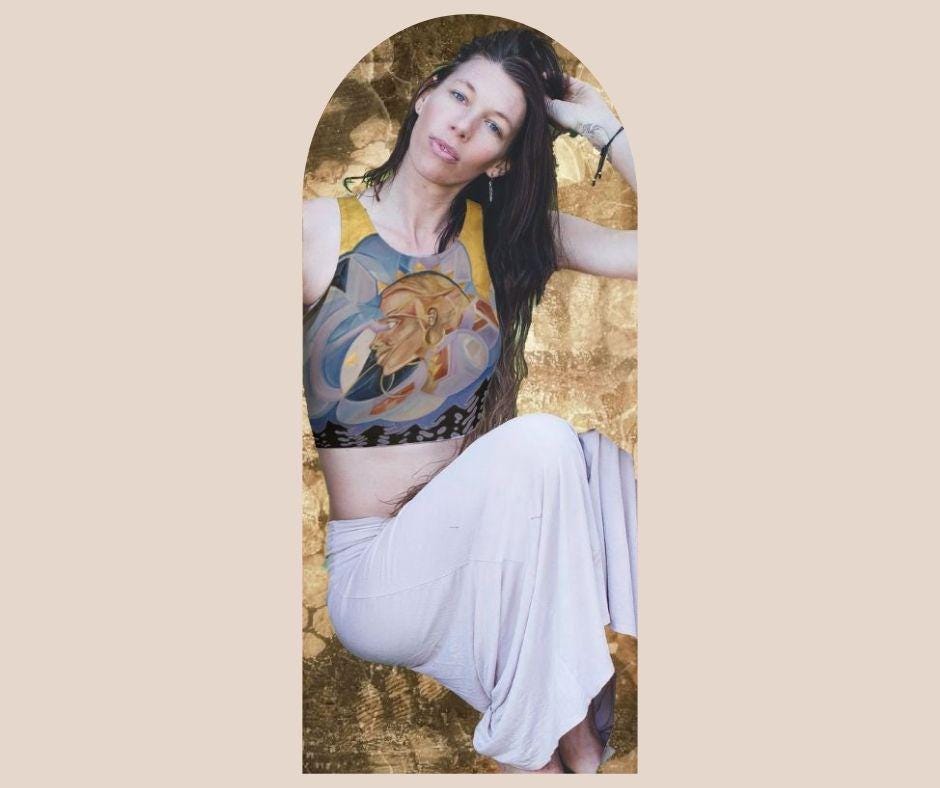 woman wearing Yoga top in hues of purple and blue with a woman face in shades of gold and beige and geometric patterns