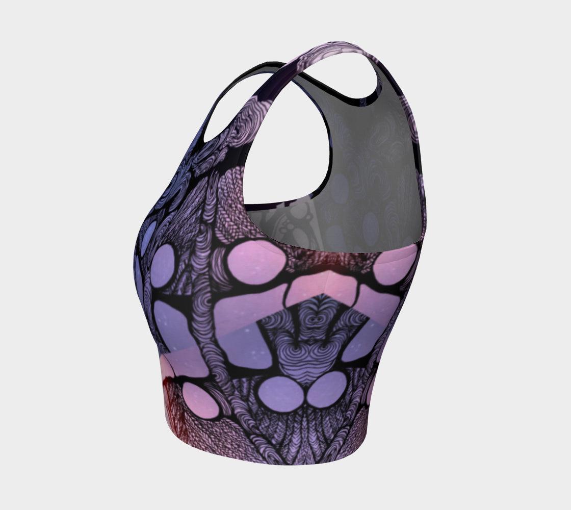 Yoga top in black blue and purple with back Lines and designs in the shape of moons and a woman next to a tree