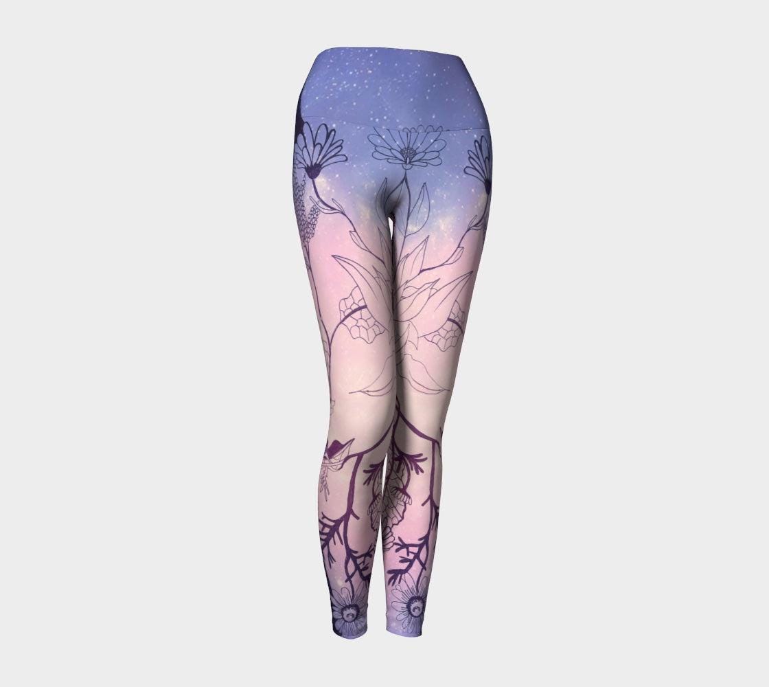 Yoga leggings in shades of pink and lilac with plants designs inline black lines on them