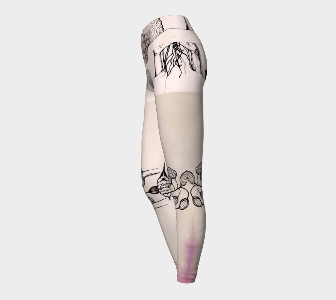 Black and white yoga leggings with designs of hands and plants and subtle hues of pink of them