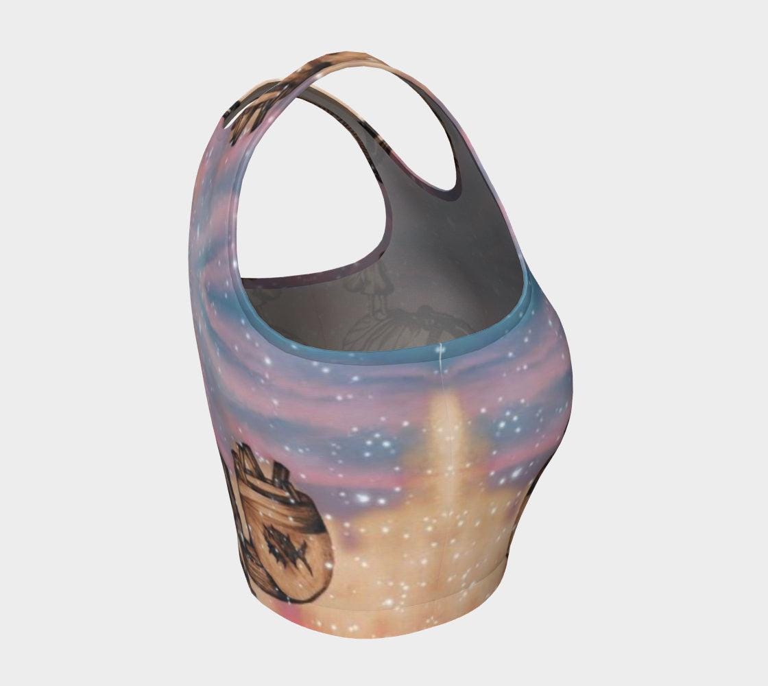 Yoga top in shades of pink and blue with a pencil drawing a little girl and stars flecked on it