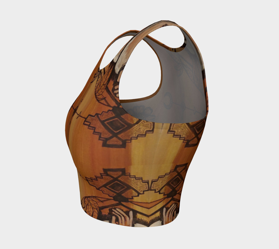 A cropped tank top with a floral leaf line and crescent moon designs on a golden brown background.